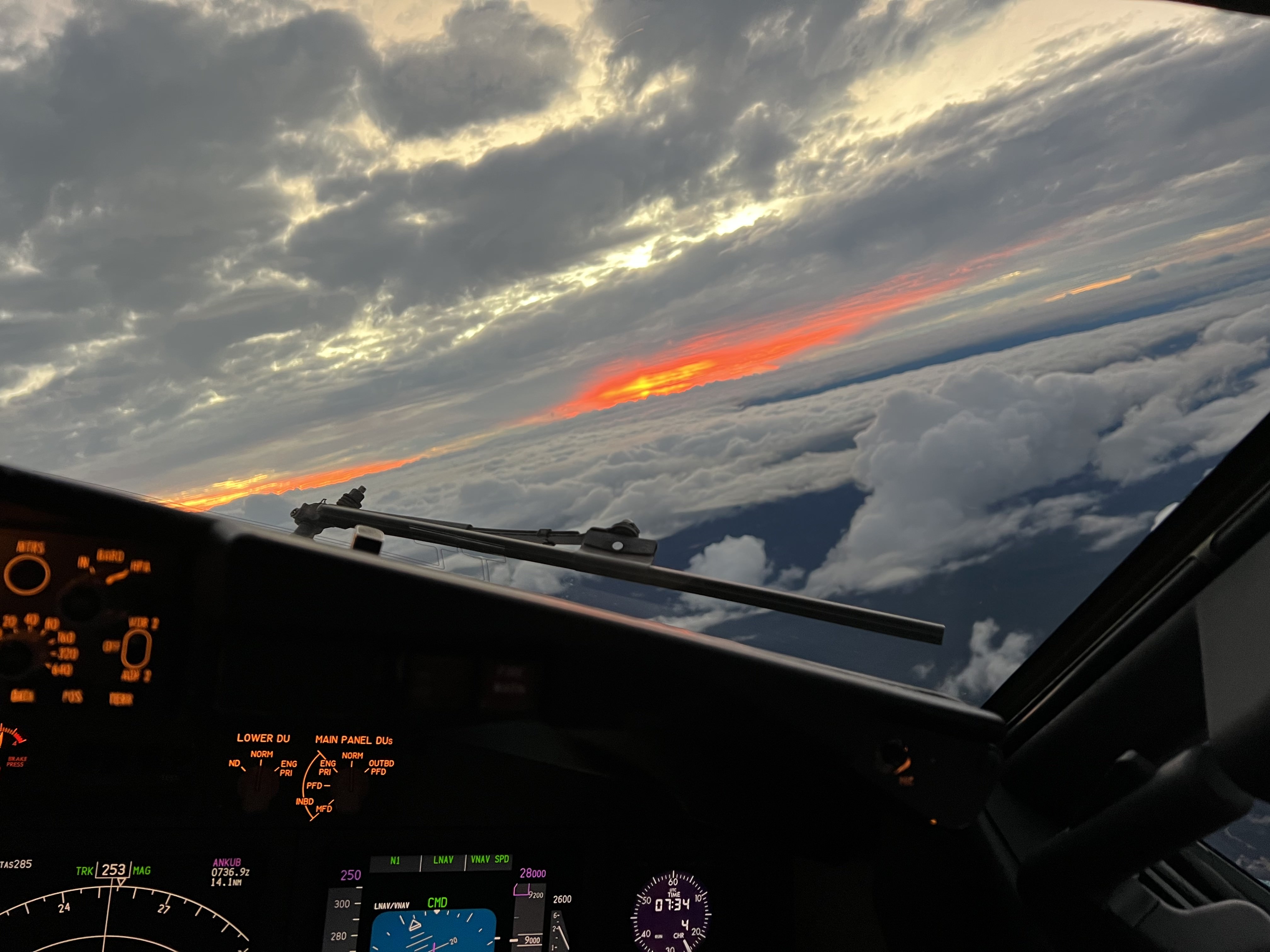fluoro cockpit controls overlooking orange sunrise